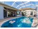 Spacious pool and patio area with screened enclosure, offering ample entertaining space at 17347 Lake Worth Blvd, Port Charlotte, FL 33948