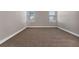 Spacious secondary bedroom with neutral carpeting and ample space at 1859 Nuremberg Blvd, Punta Gorda, FL 33983