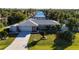 Aerial view of the house, showcasing its location by the canal at 18749 Ackerman Ave, Port Charlotte, FL 33948