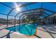 Enclosed heated pool and spa with canal view at 18749 Ackerman Ave, Port Charlotte, FL 33948