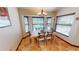 Casual dining area with bay window and chandelier at 23155 Adela Ave, Port Charlotte, FL 33952