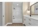 Renovated bathroom featuring a bathtub, marble shower, and white vanity at 2387 Tamarind St, Port Charlotte, FL 33948