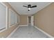 Bedroom with wood-look flooring, ceiling fan, and neutral walls at 2387 Tamarind St, Port Charlotte, FL 33948
