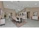 Open-concept dining area with modern lighting, sleek marble floors, and a view to the kitchen at 2387 Tamarind St, Port Charlotte, FL 33948