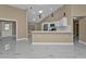 Modern kitchen with white cabinets and breakfast bar at 2387 Tamarind St, Port Charlotte, FL 33948