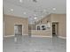 Modern kitchen with white cabinets, stainless steel appliances, and a breakfast bar at 2387 Tamarind St, Port Charlotte, FL 33948