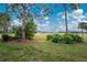 View of the golf course from the backyard at 26138 Stillwater Circle, Punta Gorda, FL 33955