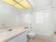 Clean bathroom with a tub, shower, and updated vanity at 26138 Stillwater Circle, Punta Gorda, FL 33955