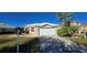 Single-story house with a white roof and garage at 26159 Stillwater Cir, Punta Gorda, FL 33955