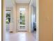 Bright entryway with tile floors and access to backyard and additional room at 2617 Cottonwood Ln, North Port, FL 34289