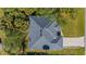 Top-down view of a single-story house showcasing its roofline and driveway at 267 Lecturn St, Port Charlotte, FL 33954