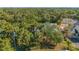 Aerial view of a property surrounded by lush vegetation at 267 Lecturn St, Port Charlotte, FL 33954