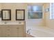 Elegant bathroom with double vanity and soaking tub at 267 Lecturn St, Port Charlotte, FL 33954