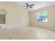 Spacious bedroom with tile flooring and large window offering natural light at 267 Lecturn St, Port Charlotte, FL 33954