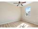 Light and airy bedroom featuring wood-look floors at 267 Lecturn St, Port Charlotte, FL 33954