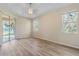 Bedroom with wood-look flooring and sliding door access to patio at 267 Lecturn St, Port Charlotte, FL 33954