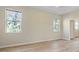 Well-lit bedroom with two windows and wood-look floors at 267 Lecturn St, Port Charlotte, FL 33954