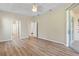 Spacious bedroom with wood-look floors and access to a bathroom at 267 Lecturn St, Port Charlotte, FL 33954
