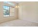 Dining room with tile floors, large window, and a chandelier at 267 Lecturn St, Port Charlotte, FL 33954