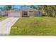 Newly constructed single-story home with attached garage and large yard at 267 Lecturn St, Port Charlotte, FL 33954