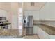 Modern kitchen with stainless steel appliances and granite countertops at 267 Lecturn St, Port Charlotte, FL 33954