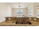 Modern kitchen with stainless steel appliances and granite countertops at 267 Lecturn St, Port Charlotte, FL 33954