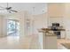 Open kitchen boasts granite countertops and a breakfast bar overlooking the Gathering room at 267 Lecturn St, Port Charlotte, FL 33954