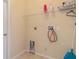 Laundry room with shelving and hook for hanging at 267 Lecturn St, Port Charlotte, FL 33954