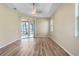 Bright and spacious living area with wood-look floors and sliding glass doors at 267 Lecturn St, Port Charlotte, FL 33954