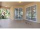 Screened porch with view of backyard and trees at 267 Lecturn St, Port Charlotte, FL 33954