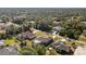 Aerial view of a residential area featuring houses and surrounding landscape at 2696 Mather Ln, North Port, FL 34286