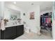 Bathroom with vanity, toilet, and walk-in closet at 2696 Mather Ln, North Port, FL 34286