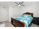 Spacious bedroom with a king-size bed and ceiling fan at 2696 Mather Ln, North Port, FL 34286