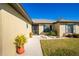 Front entrance with walkway and attractive landscaping at 2696 Mather Ln, North Port, FL 34286