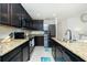 Modern kitchen with granite countertops and stainless steel appliances at 2696 Mather Ln, North Port, FL 34286