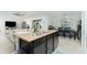 Island kitchen with granite countertops and stainless steel appliances at 2696 Mather Ln, North Port, FL 34286
