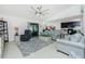 Spacious living room with comfy seating and large TV at 2696 Mather Ln, North Port, FL 34286