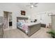Main bedroom with king-size bed and ensuite bathroom at 2696 Mather Ln, North Port, FL 34286