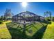 Inviting pool and spa area with screened enclosure at 2696 Mather Ln, North Port, FL 34286