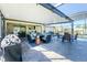 Relaxing covered patio with pool and grill at 2696 Mather Ln, North Port, FL 34286