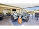 Covered patio with firepit and pool access at 2696 Mather Ln, North Port, FL 34286