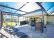 Relaxing screened patio with seating area, perfect for outdoor entertaining at 2696 Mather Ln, North Port, FL 34286