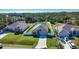 New construction home boasting a meticulously maintained lawn and an inviting driveway and new fence at 3393 Kacher Rd, North Port, FL 34288