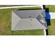 Aerial view of a house showcasing the roof and surrounding lawn at 3393 Kacher Rd, North Port, FL 34288