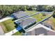 Aerial view of two houses with large fenced yards and a pool at 3393 Kacher Rd, North Port, FL 34288