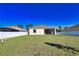 View of the expansive backyard with a privacy fence, offering space for relaxation and entertainment at 3393 Kacher Rd, North Port, FL 34288