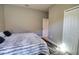 Bedroom features carpet, closet and door to the hallway at 3393 Kacher Rd, North Port, FL 34288