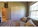 Bedroom featuring a large window, closet and ensuite bathroom at 3393 Kacher Rd, North Port, FL 34288