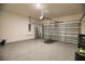 Spacious two car garage featuring epoxy flooring and an automatic garage door opener at 3393 Kacher Rd, North Port, FL 34288