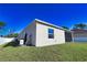 Single story house with a screened porch and fenced backyard at 3393 Kacher Rd, North Port, FL 34288